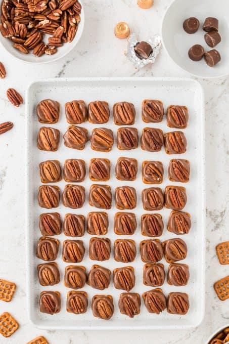 A cookie sheet full of Rolo Pretzels.