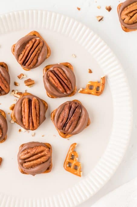 Pretzels, Rolo Candy, and a pecan half.