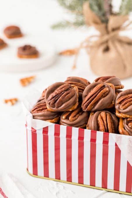 A decorative box filled with easy 3 ingredient Rolo Pretzels.