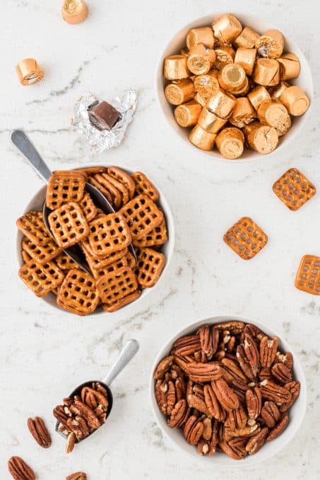 Ingredients to make pretzels covered with Rolos and pecans.