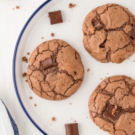 Cookies made out of a brownie mix with additional chocolate chunks on a plate.