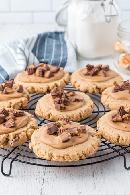 Reese's Peanut Butter Cups on top of Copycat CRUMBL cookies.