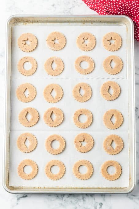 A baking sheet full of cookies ready for the oven.