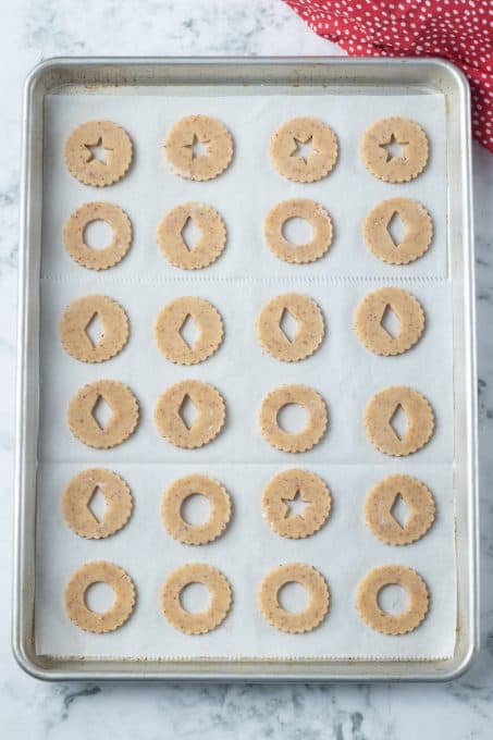 A baking sheet full of cookies ready for the oven.