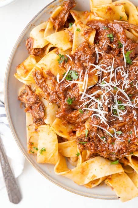 A meat sauce over pasta noodles.