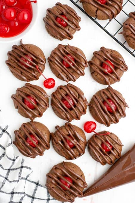 Chocolate cherry cookies drizzled with chocolate.
