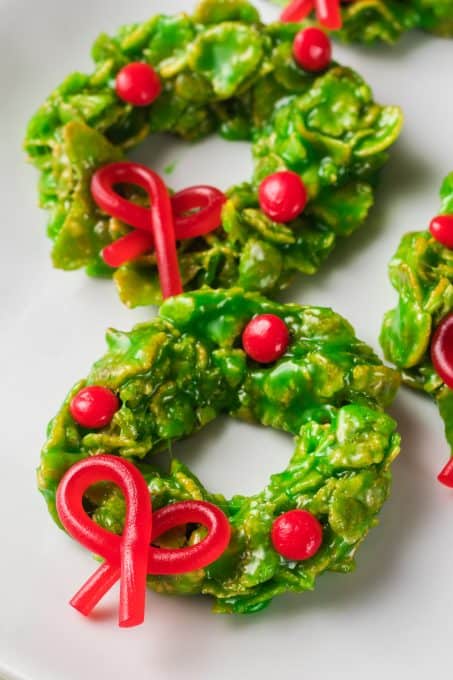 Green Cornflake Cookies with licorice bows and cinnamon candies.