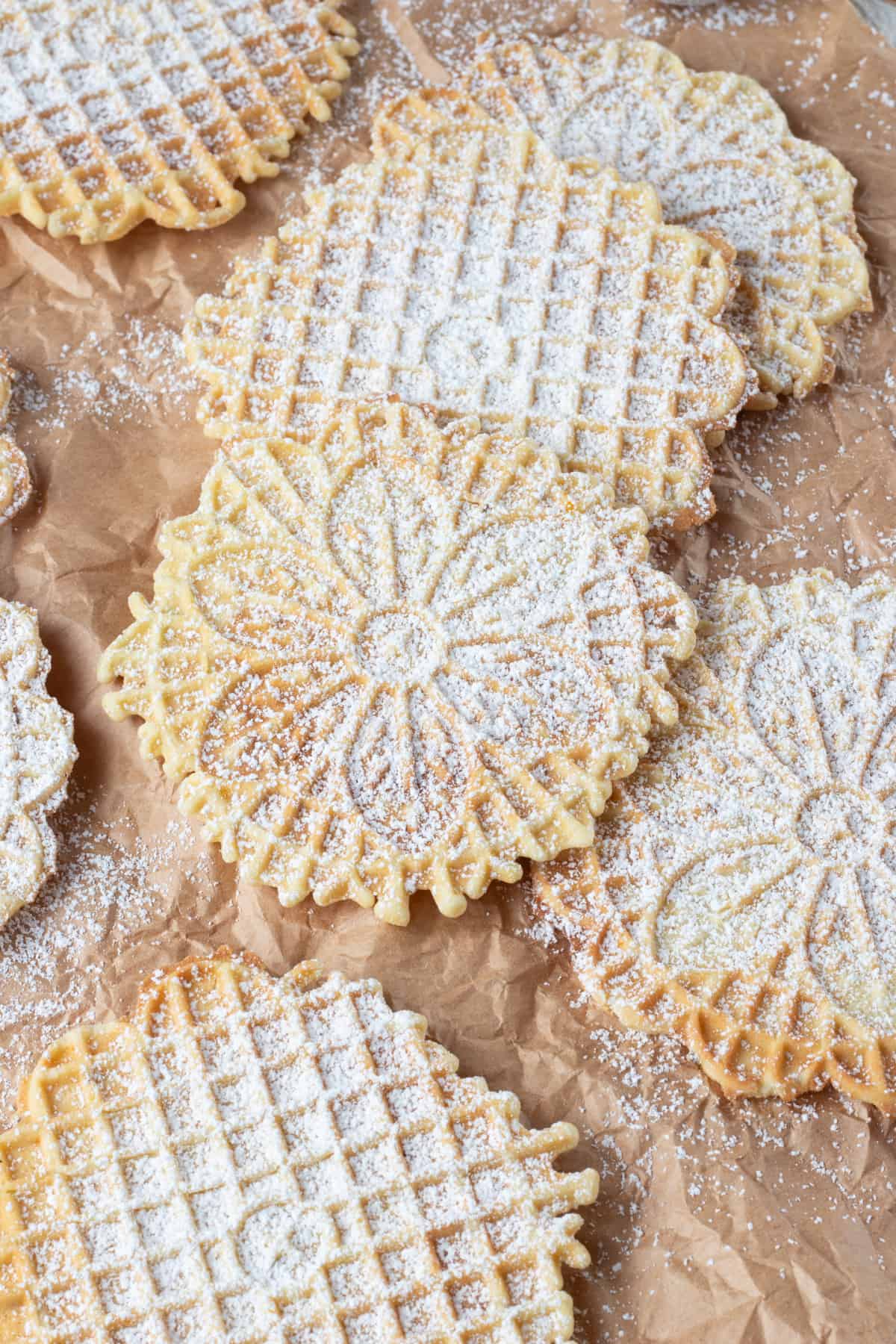 Italian waffle cookies dusted with powdered sugar.