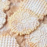 Italian waffle cookies dusted with powdered sugar.