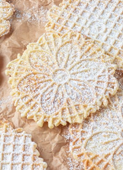 Italian waffle cookies dusted with powdered sugar.