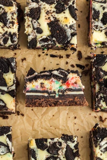 A cheesecake bar with Oreos and colored sprinkles.