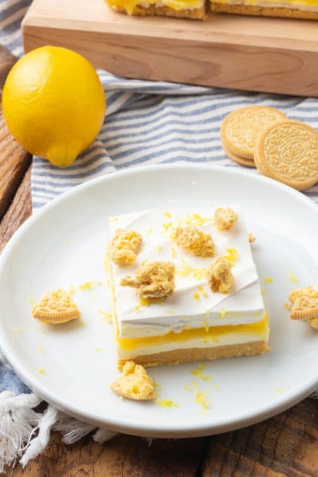 Crushed Oreos on top of cheesecake bars with lemon.