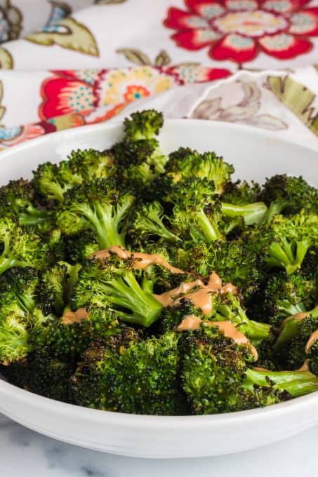 Peanut sauce on top of broccoli.