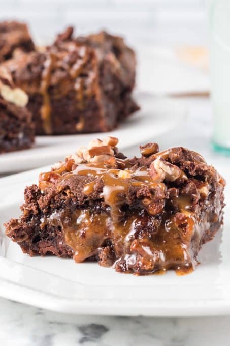 Caramel oozing out of a gooey chocolate bar.