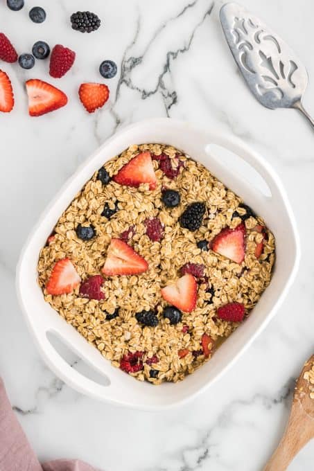 Oatmeal with fresh berries ready to be baked.