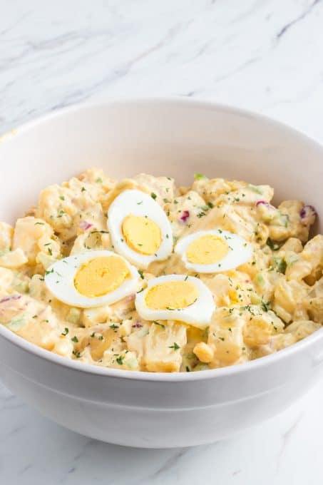 A potato salad with hard boiled eggs