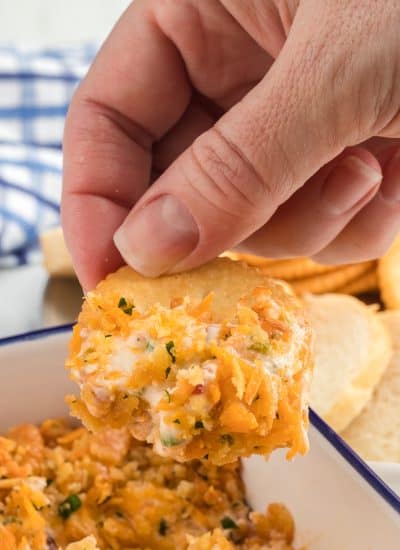 Cheesy jalapeno dip on a cracker.