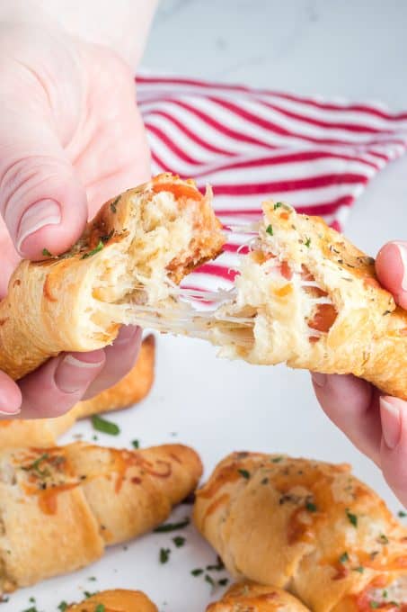 The cheese pull of a Pepperoni roll made with crescent dough.