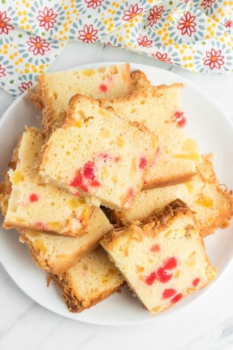 Cherry, coconut and pineapple quick bread on a plate.