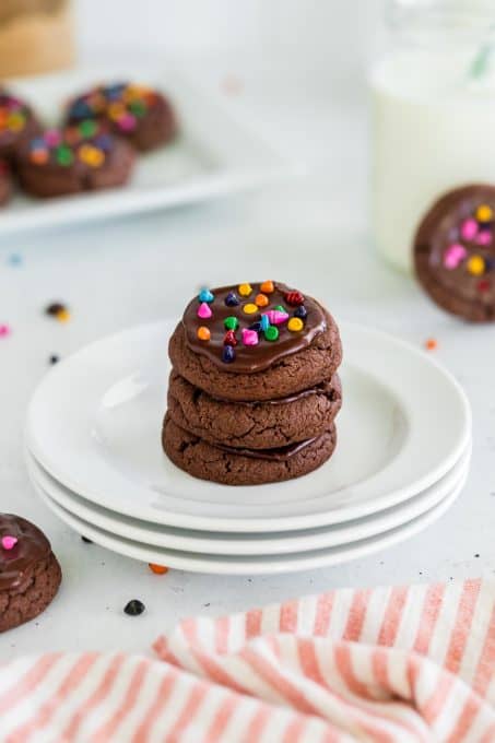 A plate of chocolate frosted cosmic cookies.