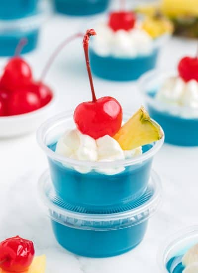 A stack of jello shots made to resemble a Blue Hawaiian