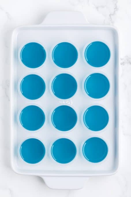 Blue jello shots ready to be chilled.