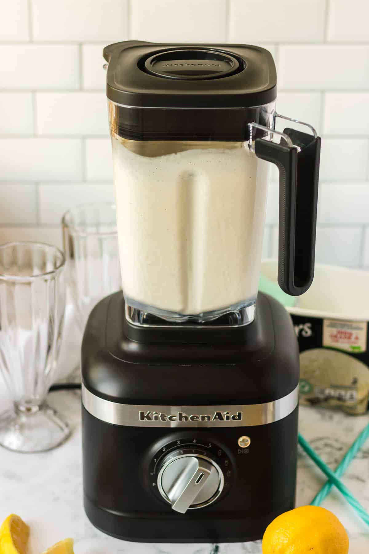A blender full of a lemonade milkshake.