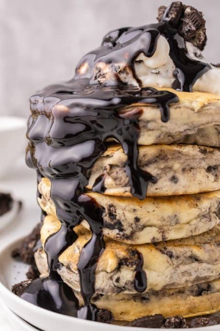 Chocolate sauce on top of pancakes made with Oreos.