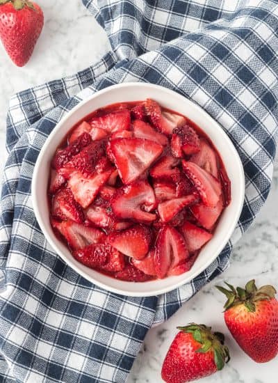 A bowl of strawberries that have been roasted in the oven.