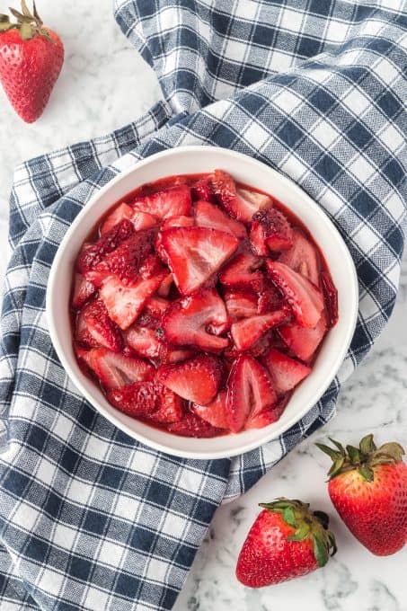 A bowl of strawberries that have been roasted in the oven.