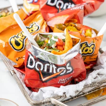 A tray of bags fill with taco ingredients for individual tacos.