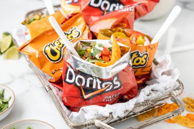 A tray of bags fill with taco ingredients for individual tacos. 