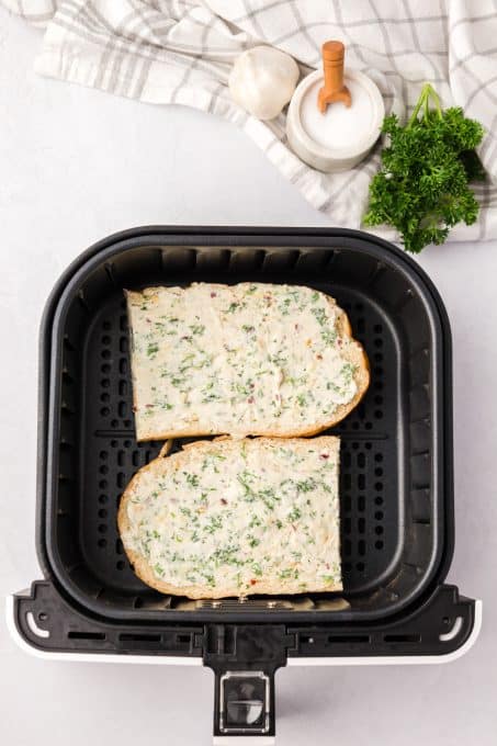 Bread with a spread of garlic butter on it.