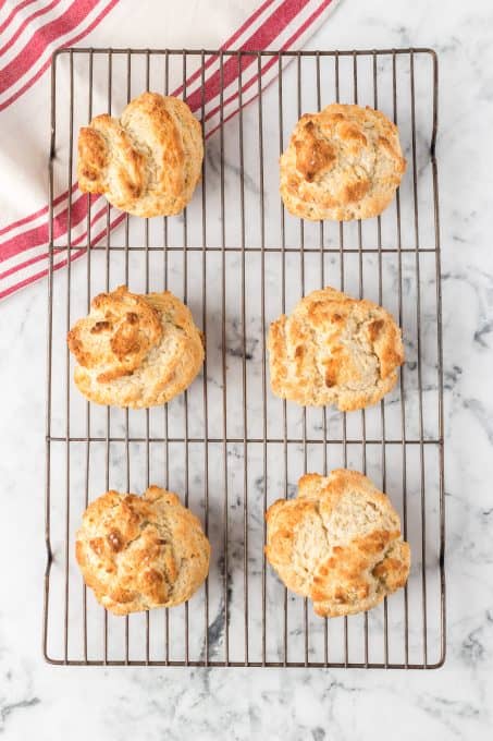 Shortcake biscuits on a wire rack.