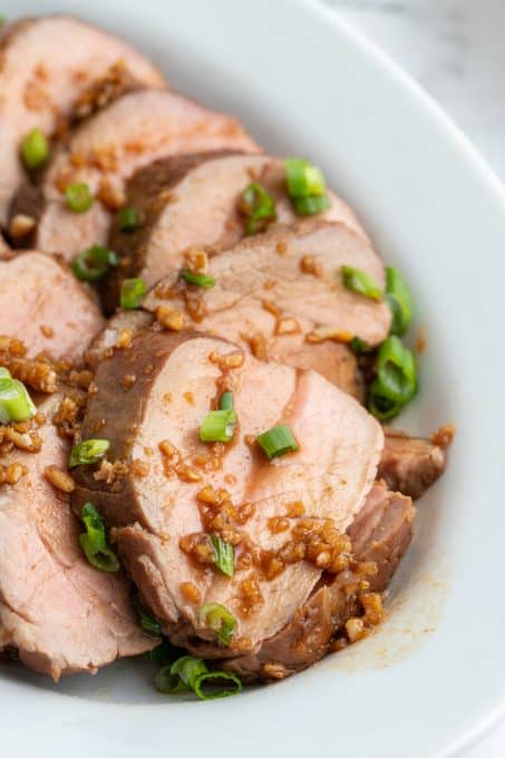 slices of pork tenderloin marinated in an Asian sauce.