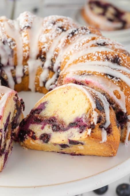 A slice of blueberry coffee cake with sour cream.