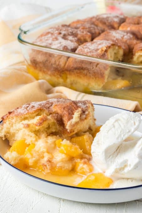 A scoop of cinnamon sugar cobbler with peaches.