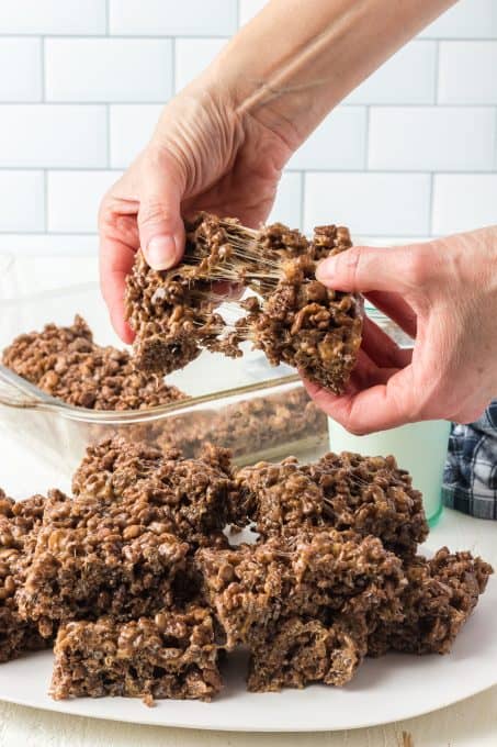 Tearing apart a Chocolate Rice Krispies Treat with peanut butter