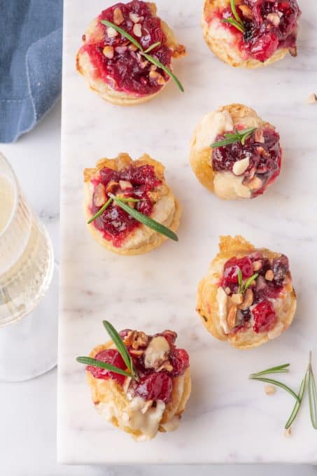 Puff pastry, brie, cranberry sauce and hazelnuts make up this simple holiday party appetizer.