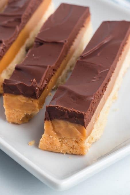Homemade shortbread bars with caramel and chocolate.
