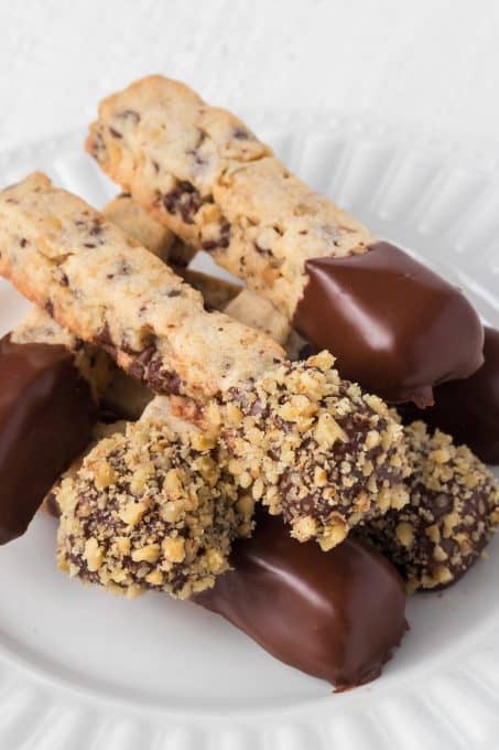 Chocolate chip and walnut Stick cookies dipped in chocolate and decorated with more walnuts.