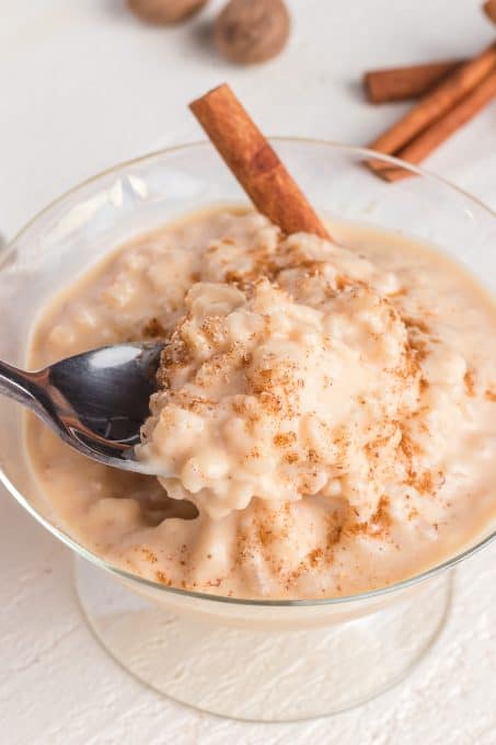 A spoonful of creamy rice pudding.