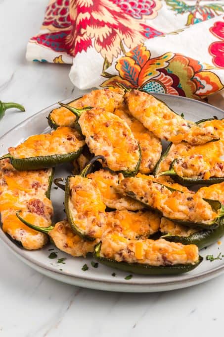 Spicy jalapeno peppers stuffed with cheese and bacon for the perfect appetizer.