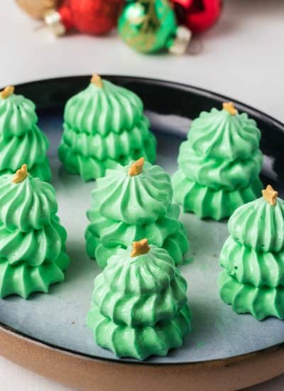 Gold stars adorn tiny trees made of meringue.