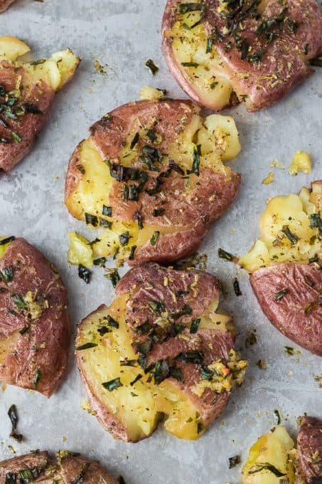 Smashed potatoes basted with garlic butter.