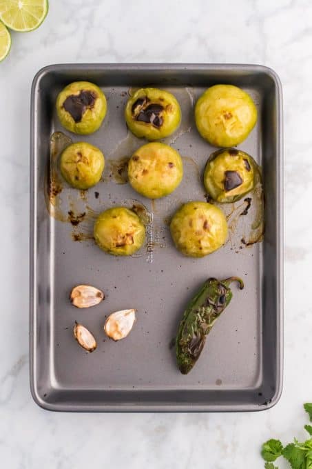 Roasted tomatillos, garlic, and jalapeno pepper.