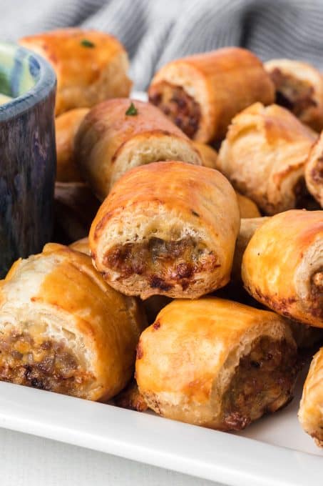 Savory sausage wrapped in puff pastry for a party appetizer.