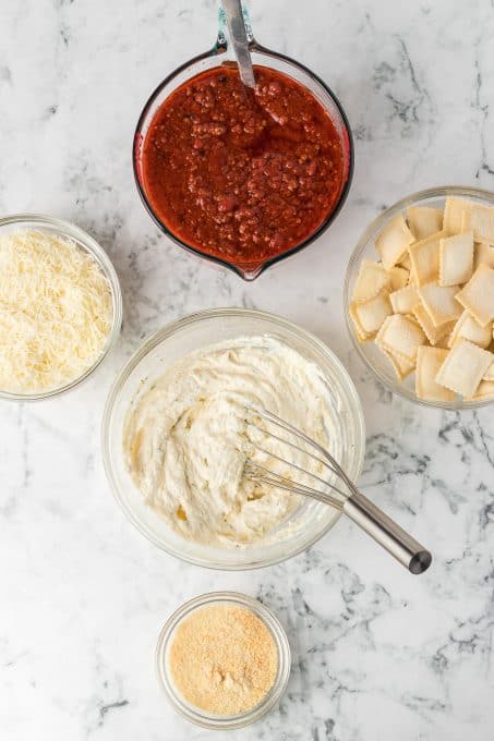 Making lasagna with frozen ravioli.