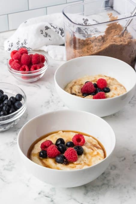 Berries, brown sugar and maple syrup on top of hot cereal.