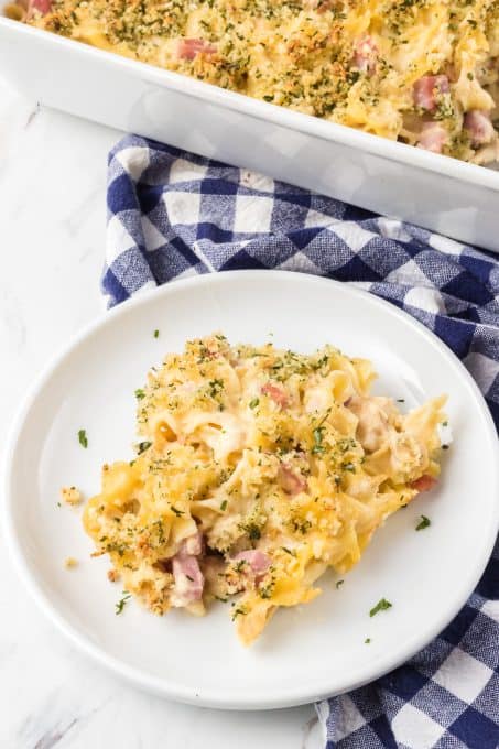 A plate of a Chicken Casserole with ham and Swiss cheese.